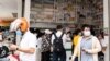 People wearing mask buys medicines at a pharmacy in Phnom Penh, Cambodia amid corona outbreak on March 17, 2020. (Malis Tum/VOA Khmer)