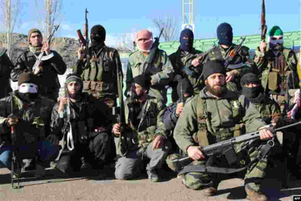 Syrian army defectors gather at the mountain resort town of Zabadani, Syria, near the Lebanese border, on Friday Jan. 20, 2012. President Bashar Assad's forces attacked Zabadani, some 17 miles (27 kilometers) west of the capital, for six days, sparking fi