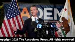 California Gov. Gavin Newsom addresses reporters, after beating back the recall attempt that aimed to remove him from office, at the John L. Burton California Democratic Party headquarters in Sacramento, Calif., Tuesday, Sept. 14, 2021. (AP Photo…