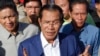 FILE - In this Aug. 1, 2018, file photo, Cambodian Prime Minister Hun Sen gestures while speaking in Phnom Penh, Cambodia. Cambodian Prime Minister Hun Sen, at the polling place near his home on the day of the general election on July 29, 2018. The official results, being announced province-by-province and party-by-party Wednesday, Aug. 15, 2018, were certain to confirm a landslide victory by Hun Sen's Cambodian People's Party, but critics called the election unfair because the only credible opposition force, the Cambodia National Rescue Party, could not contest the polls because it was dissolved by court order last year. (AP Photo/Heng Sinith)