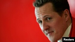 Michael Schumacher of Germany looks on during a news conference at the end of the official presentation of the new Ferrari Formula One race car 248 F1 at the Mugello racetrack in Scarperia, central Italy, January 24, 2006. REUTERS/Tony Gentile - RTR188ZY