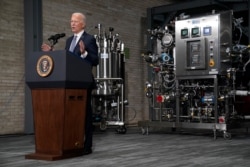 President Joe Biden speaks to the press after a tour of a Pfizer manufacturing site, Feb. 19, 2021, in Portage, Mich.
