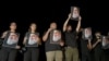 Supporters of Lebanon's Hezbollah leader Hassan Nasrallah carry his pictures as they gather in Sidon, Lebanon, on Sept. 28, 2024, following his killing in an Israeli airstrike in Beirut's southern suburbs the previous day.