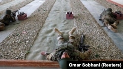 AFGHANISTAN -- Afghan National Army (ANA) soldiers take part in a training exercise at the Kabul Military Training Centre (KMTC) in Kabul, January 27, 2019