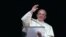 Pope Francis waves during his Angelus prayer in Saint Peter's Square at the Vatican, Dec. 26, 2013. 