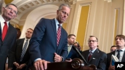 Senate Majority Leader John Thune speaks to reporters as Republicans work to pass an interim spending bill that would avoid a partial government shutdown, at the Capitol in Washington, March 11, 2025.