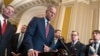 Senate Majority Leader John Thune speaks to reporters in Washington while Republicans work to pass an interim spending bill that would avoid a partial government shutdown, March 11, 2025. 