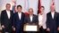 From left, prime ministers Scott Morrison of Australia, Shinzo Abe of Japan, Peter O'Neill of Papua New Guinea, Jacinda Ardern of New Zealand and U.S. Vice President Mike Pence pose after signing the Papua New Guinea Electrification Partnership, Nov. 18, 2018, in New Guinea.