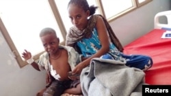 FILE - Survivors of an air strike by Ethiopian government forces receive treatment at the Shire Shul General hospital in the town of Dedebit in northern region of Tigray, Ethiopia January 8, 2022. 