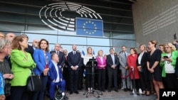 FILE -- European Council President Charles Michel (C,L), European Parliament President Roberta Metsola (C) and European Commission President Ursula Von der Leyen (C,R) pay tribute to the victims of the Hamas attacks in Israel, at the European Parliament on October 11, 2023.