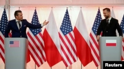 U.S. Defense Secretary Pete Hegseth and Polish Defense Minister Wladyslaw Kosiniak-Kamysz attend a press conference in Warsaw, Poland, on Feb. 14, 2025. (Agencja Wyborcza.pl via Reuters)