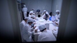Researchers work in a lab at the Yisheng Biopharma company in Shenyang, in China’s northeast Liaoning province on June 10, 2020. - The company is one of a number in China trying to develop a vaccine for the COVID-19.