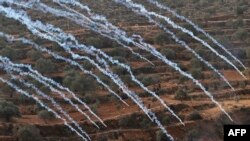 Palestinian protesters and Israeli security forces clash following a demonstration against settlements in the village of Beita in the occupied West Bank.