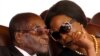 FILE: President Robert Mugabe and his wife Grace attend the burial of two independence luminaries, Maud Muzenda and George Rutanhire, in Harare, Zimbabwe August 26,2017. REUTERS/Philimon Bulawayo