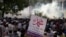 Pakistani protesters burn tires to block the main highway in Rawalpindi, Pakistan, September 21, 2012.