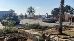 Israeli military vehicles operate in the Gazan side of the Rafah Crossing