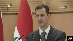 Syria's President Bashar al-Assad speaks in Damascus in this still image taken from video, June 20, 2011