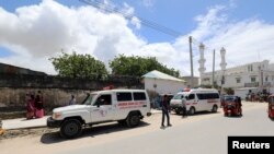 An ambulance is seen near a blast site that rocked a military base in Mogadishu, Somalia August 8, 2020. 