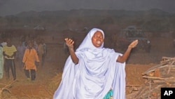 FILE— A woman cries as she calls out to the government to help and rescue school children that were kidnapped by gunmen in Chikun, Nigeria, Thursday, March 7, 2024. 