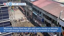 VOA60 Addunyaa - Myanmar: Police fire tear gas and use a tractor to smash through barricades set up by protesters