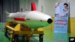 FILE - In this photo released Feb. 7, 2019, by Sepahnews, the website of the Iranian Revolutionary Guard, a Dezful surface-to-surface ballistic missile is displayed in an undisclosed location in Iran. 