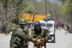 Police are seen in India-controlled Kashmir, in this undated photo by photojournalist Qisar Mir.