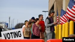 FILE: Residents wait in line to cast their ballots for the 2022 midterm election at the Franklin County Board of Elections during early voting hours in Columbus, Ohio, U.S., November 5, 2022. 