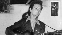 American Folk Singer Woody Guthrie. “This Land is Your Land” became most famous song.