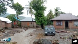 A damaged vehicle sits in the flood water in Ile Ape, on Lembata Island, East Nusa Tenggara province, Indonesia, Sunday, April 4, 2021. Multiple disasters caused by torrential rains in eastern Indonesia have left dozens of people dead or missing…