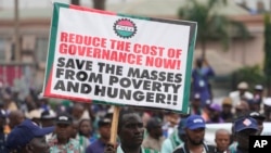 FILE - Nigeria labor union protest in solidarity with the Academic Staff Union of Universities against the high cost of living, on the street in Lagos, Nigeria, on July 26, 2022.