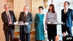 Members of the Nobel Committee for Literature (L-R) Chairman Anders Olsson, Per Wastberg, Rebecka Karde, Mikaela Blomqvist and Henrik Petersen announce the winners of the 2018 and 2019 Nobel Prize in Literature at the Swedish Academy in Stockholm.