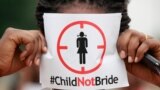 FILE- In this Saturday, July 20, 2013, file photo, a woman protests against underage marriage in Lagos, Nigeria. Child marriage affects nearly 15 million girls around the world, and West and Central Africa has six of the 10 countries with the highest…