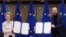 European Commission President Ursula von der Leyen, left, and European Council President Charles Michel show signed EU-UK Trade and Cooperation Agreement at the European Council headquarters in Brussels, Belgium.