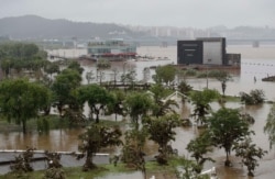 A part of a park near the Han River are flooded due to heavy rain in Seoul, South Korea, Aug. 9, 2020. The safety ministry said the Seoul area and the southern region are expected to receive more heavy rain on Sunday.