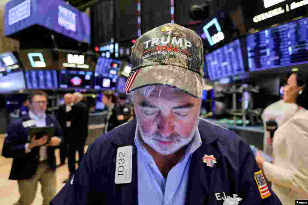 A trader wears a hat in support of Republican Donald Trump, after he won the U.S. presidential election, at the New York Stock Exchange (NYSE) in New York City, Nov. 6, 2024.