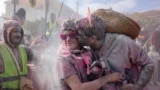 Revelers participate in 'flour war', dousing each other with tons of colored flour, marking Clean Monday-the end of carnival season in the coastal town of Galaxidi, Greece, March 3, 2025. 