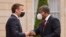 FILE: In an earlier photo, France's President Emmanuel Macron (L) welcomes Angola's President Joao Lourenco upon his arrival for a dinner at the Elysee Presidential Palace in Paris. Taken May 17, 2021.