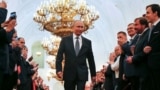 Russian President Vladimir Putin walks before an inauguration ceremony at the Kremlin in Moscow, Russia May 7, 2018. 