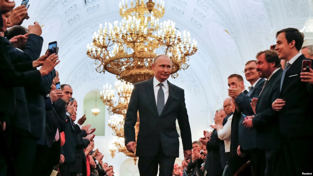 Russian President Vladimir Putin walks before an inauguration ceremony at the Kremlin in Moscow, Russia May 7, 2018. 