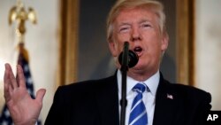 President Donald Trump speaks in the Diplomatic Reception Room of the White House, Nov. 15, 2017, in Washington. 