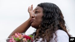 Rep. Cori Bush, D-Mo., cries after it was announced that the Biden administration will enact a targeted nationwide eviction moratorium outside of Capitol Hill in Washington on Aug. 3, 2021.