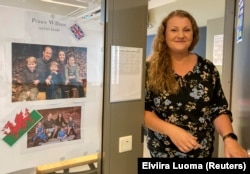 English teacher Maija Kaunonen opens the door to her classroom at Pohjolanrinne middle school in Riihimaki, Finland, September 6, 2024. (REUTERS/Elviira Luoma)