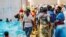 FILE - Burundian refugees arrive at Gashora reception center in Rwanda, April 28, 2015. Sixty-six refugees from Sudan, Somalia and Eritrea were freed in Libya and flown to Rwanda, Sept. 27, 2019, eventually traveling to the Gashora site.