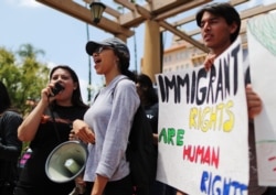 FILE - Protesters demonstrate against the termination of the Deferred Action for Childhood Arrivals (DACA) program outside the 9th Circuit Court of Appeals in Pasadena, California, May 15, 2018.