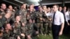 FILE - French President Emmanuel Macron celebrates with French soldiers during a Christmas dinner at Port-Bouet military camp near Abidjan, Ivory Coast, Dec. 21, 2019, during a visit to West Africa.