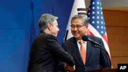 U.S. Secretary of State Antony Blinken and South Korean Foreign Minister Park Jin shake hands during a joint news conference after their meeting at the foreign ministry in Seoul, South Korea, Nov. 9, 2023. 