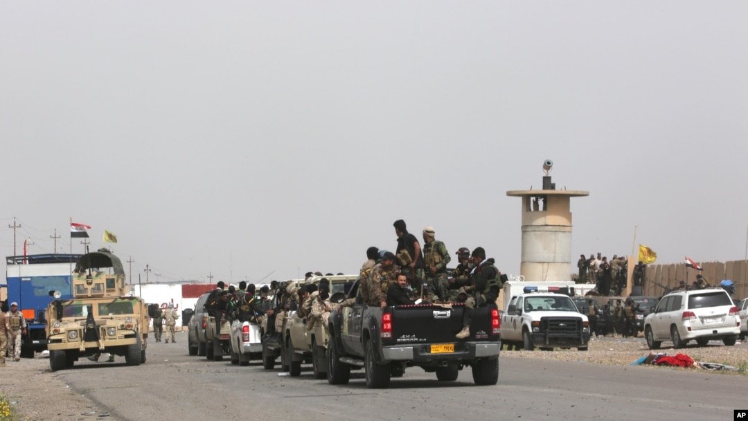 Iraqi security forces and Shi'ite militiamen prepare to attack Islamic State extremists in Tikrit, 130 kilometers (80 miles) north of Baghdad, March 13, 2015. 