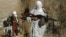 FILE - Armed Taliban fighters are seen at an undisclosed location in Nangarhar province, Afghanistan, Dec.13, 2010.