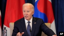 U.S. President Joe Biden speaks during a trilateral meeting with the Prime Minister of Japan Shigeru Ishiba and the President of South Korea Yoon Suk Yeol in Lima, Peru, Nov. 15, 2024. 