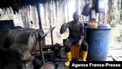 Wilson Ovwiroro is seen at his makeshift distillery in Sapele, Nigeria, Sept. 15, 2021.